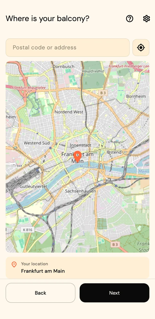 Location step with map, address search, and a pin placed on the city